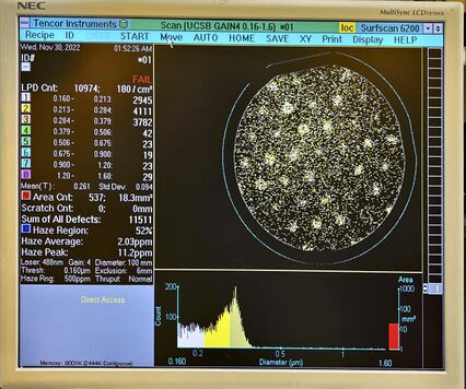 Photo of surfscan showing high particle count nd hexagonal grid pattern in particle concentrations.