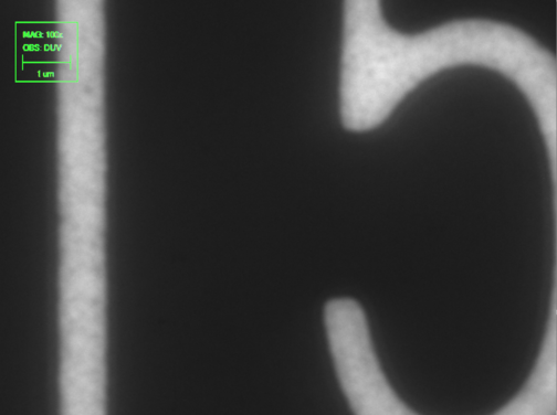 DUV microscope image with 1µm scale bar