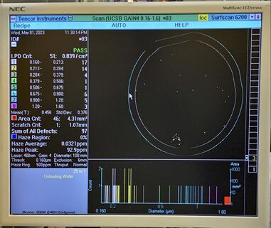 Photo of Surfscan screen showing low particles on wafer.
